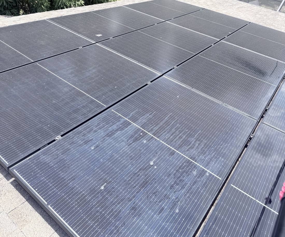 Solar panels covered in dirt before a cleaning